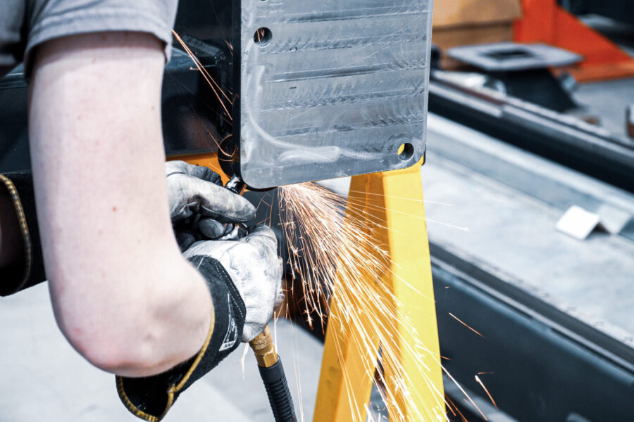 AGT Robotics robot‑welding system grinding preparation on structural steel beam