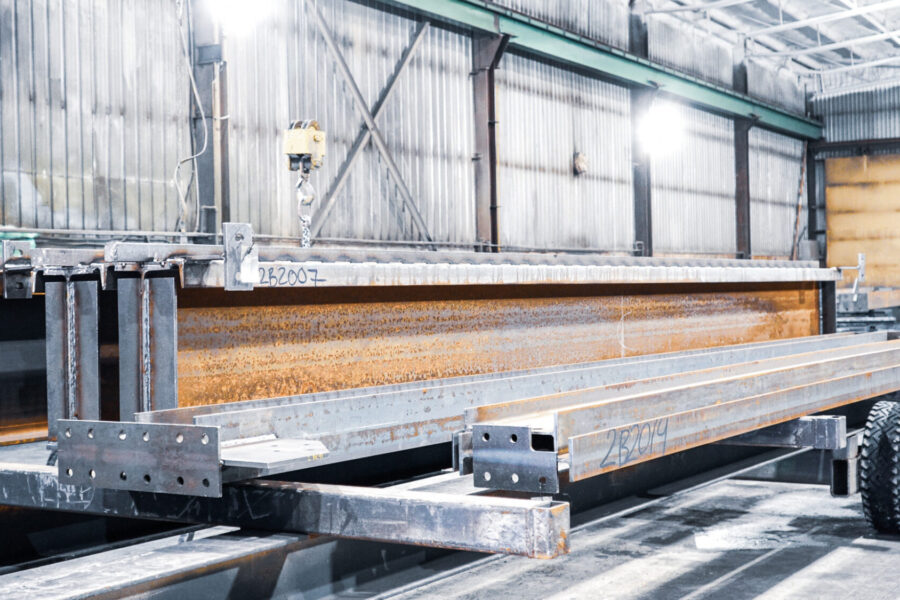 Structural steel parts in queue for painting.