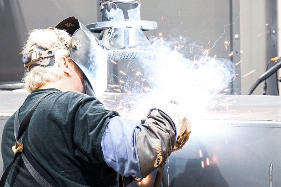 Welder working on petroleum tank